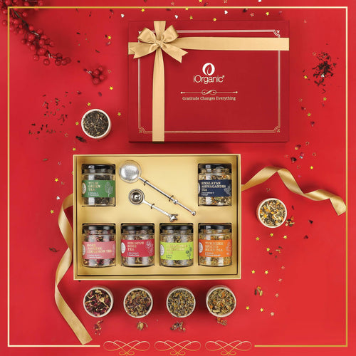 The Coastal Calm Tea Collection Box with 6 loose leaf wellness teas, nickel tea spoon, and telescopic brass strainer